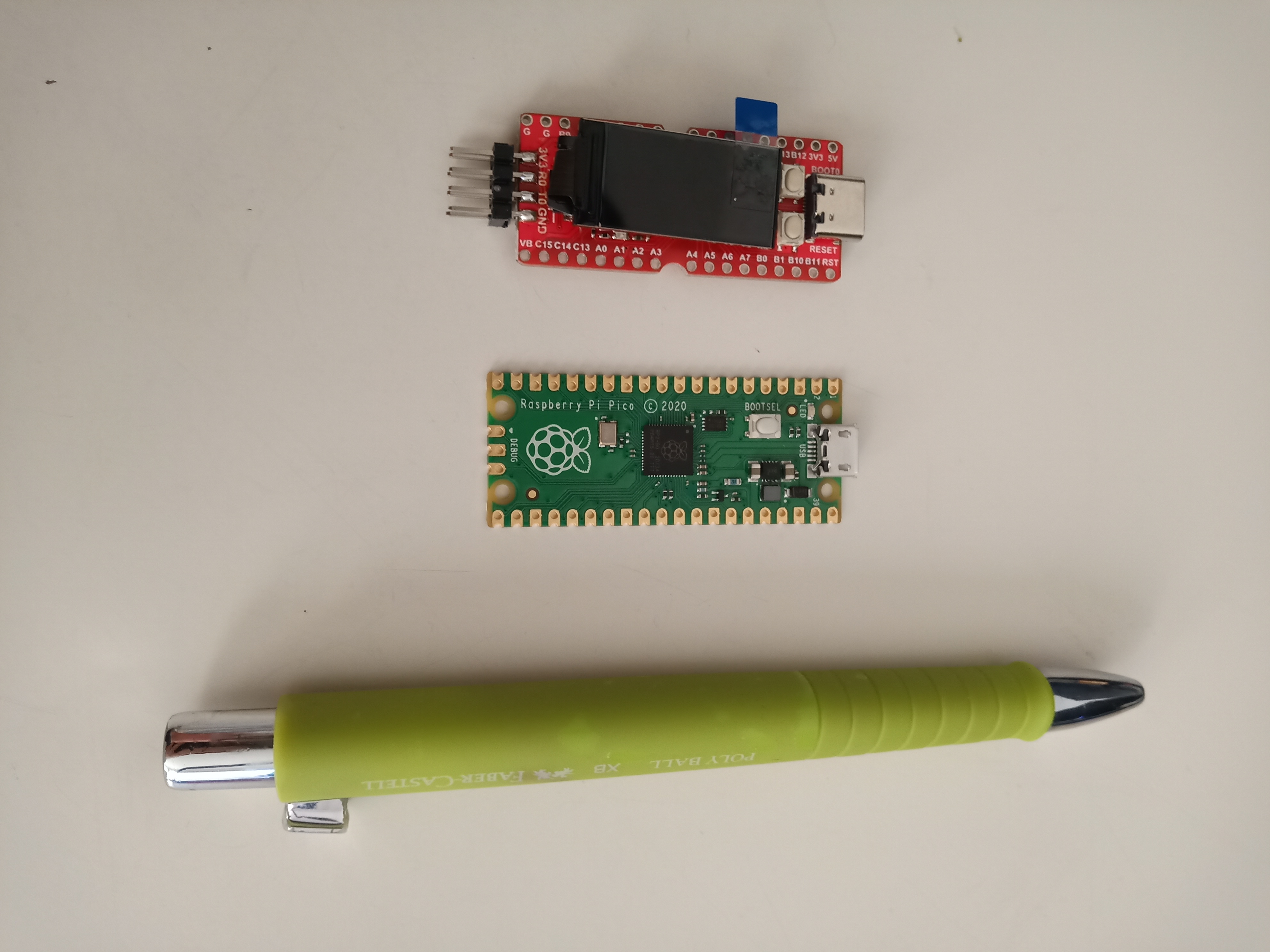 *The Longan Nano, Raspberry Pi Pico and a pen for scale.*